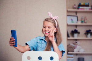 fashion-girl-blogger-video-chating-making-v-sign