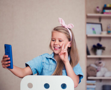 fashion-girl-blogger-video-chating-making-v-sign